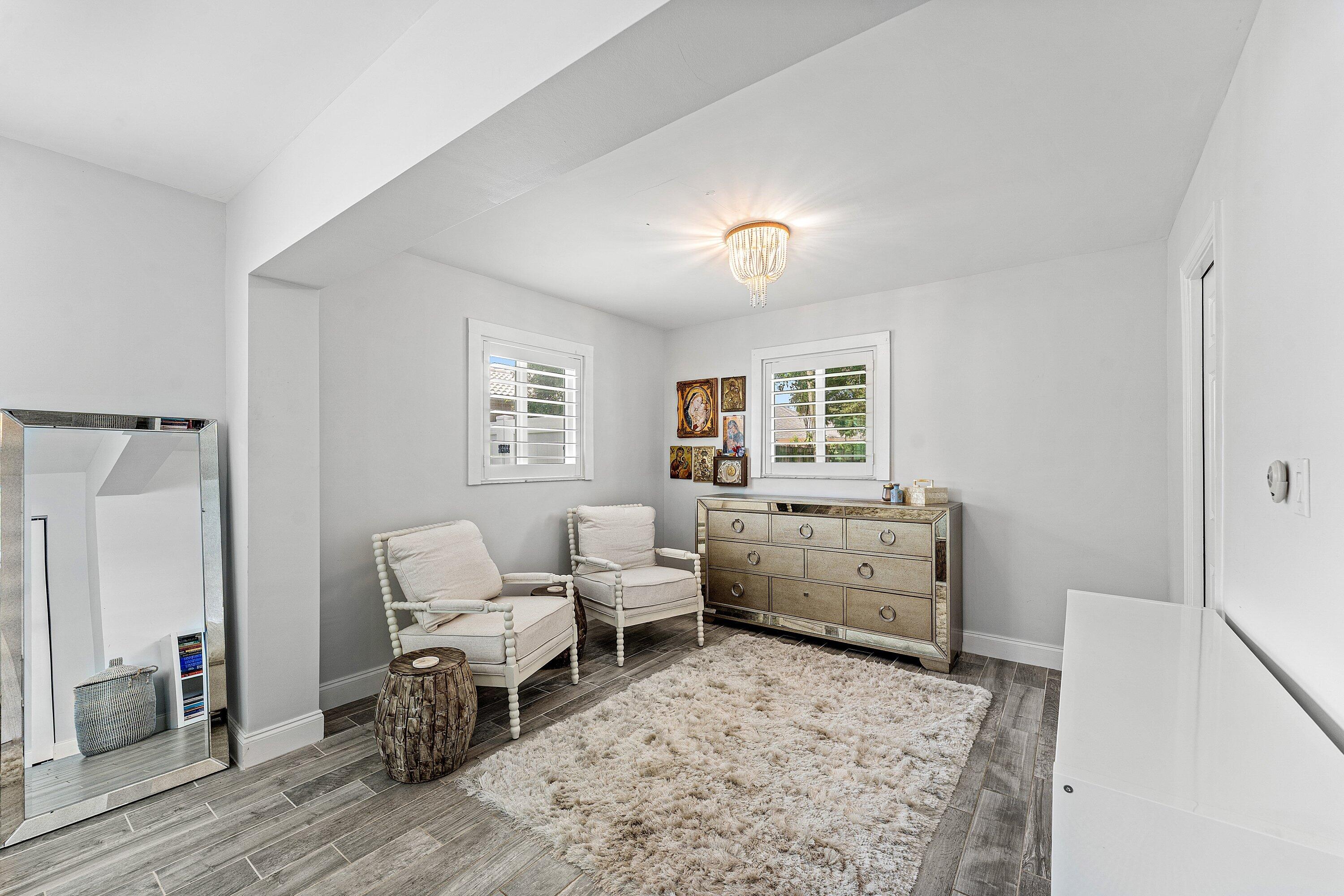 581 Northwest 13th Drive Boca Raton, FL 33486 - Photo 24 of 39 a bedroom with furniture and a window