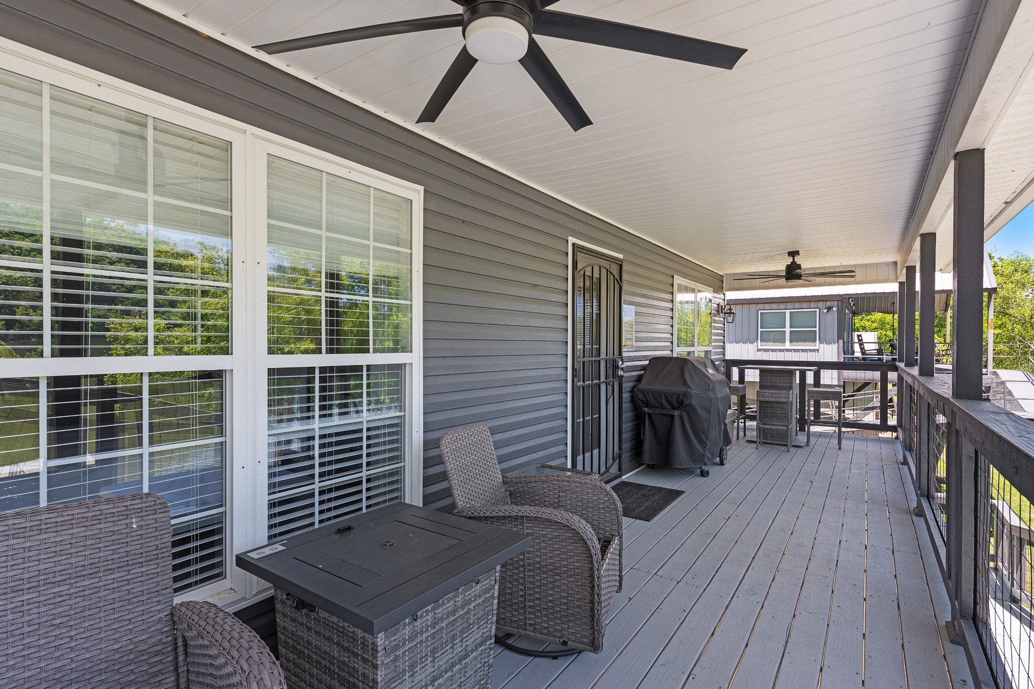 958 Pevahouse Camp Lane Decaturville, TN 38329 - Photo 4 of 32 a view of balcony with furniture and wooden floor