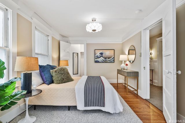 a bedroom with a bed and a lamp