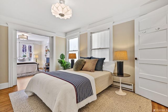 a spacious bedroom with a bed and window