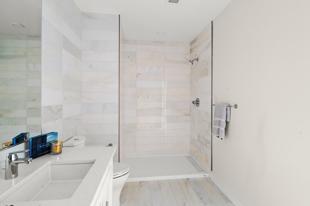 301 Border Street, Unit 311 Boston, MA 02128 - Photo 16 of 33 a bathroom with a sink and a shower