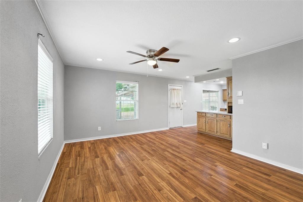 358 Wright Road Waxahachie, TX 75167 - Photo 18 of 38 a view of workspace with wooden floor and a window
