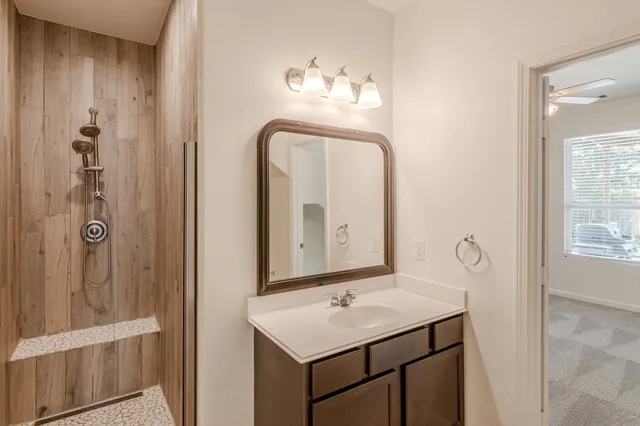 a bathroom with a sink and a mirror