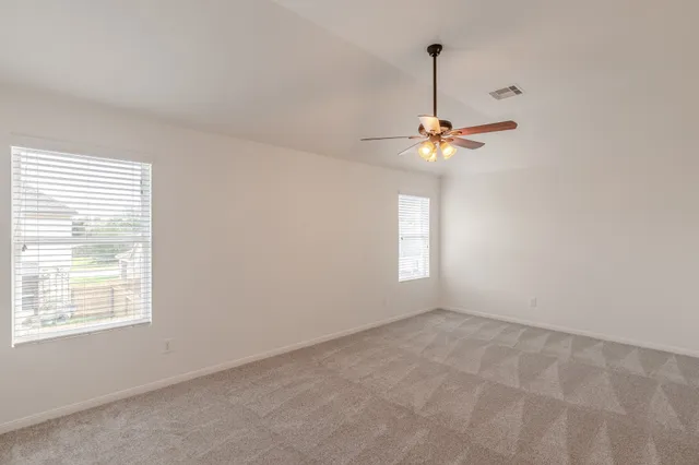 a view of an empty room with a window