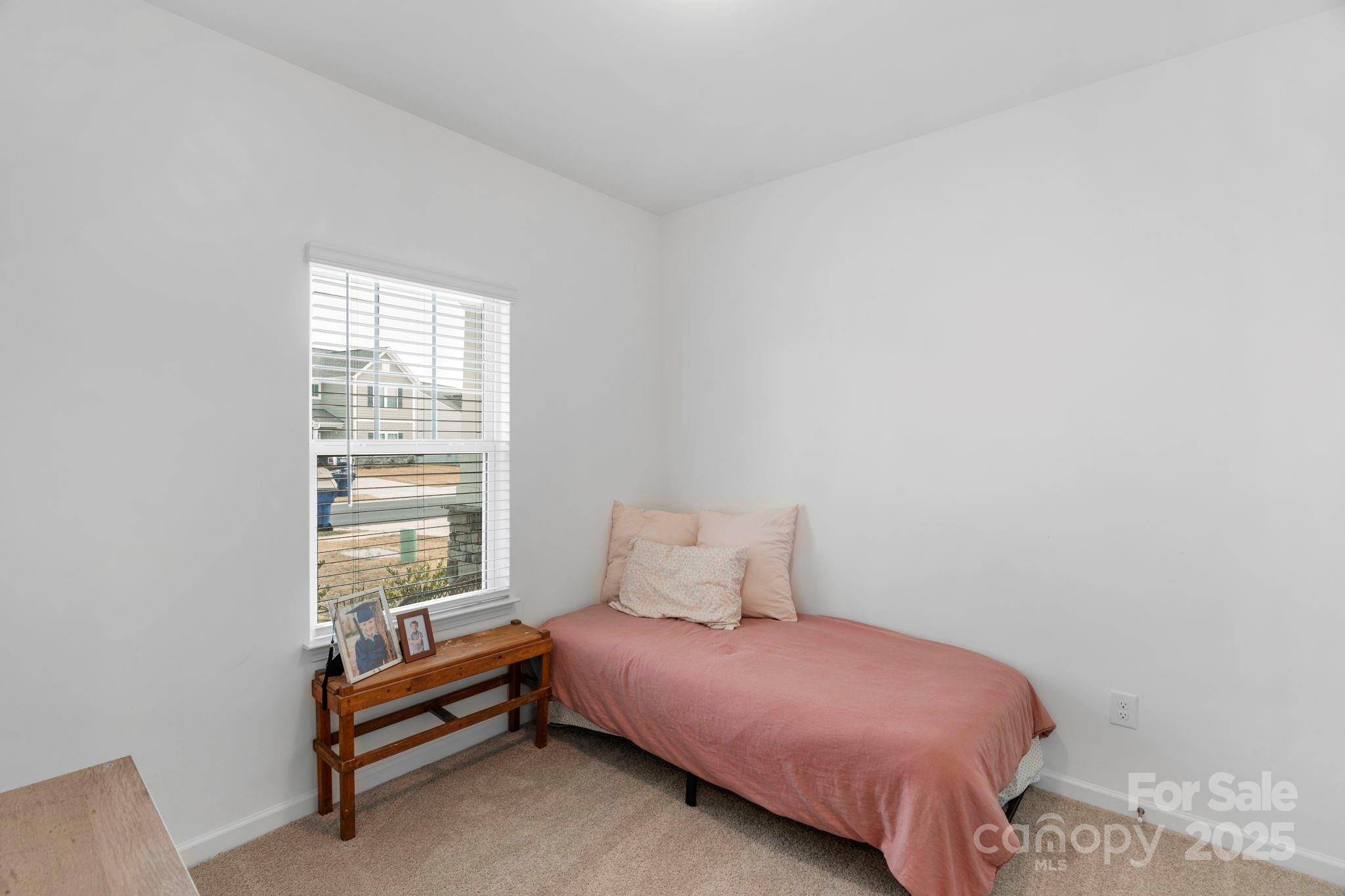 106 Aspire Circle Wingate, NC 28174 - Photo 33 of 39 a bedroom with a bed and a window