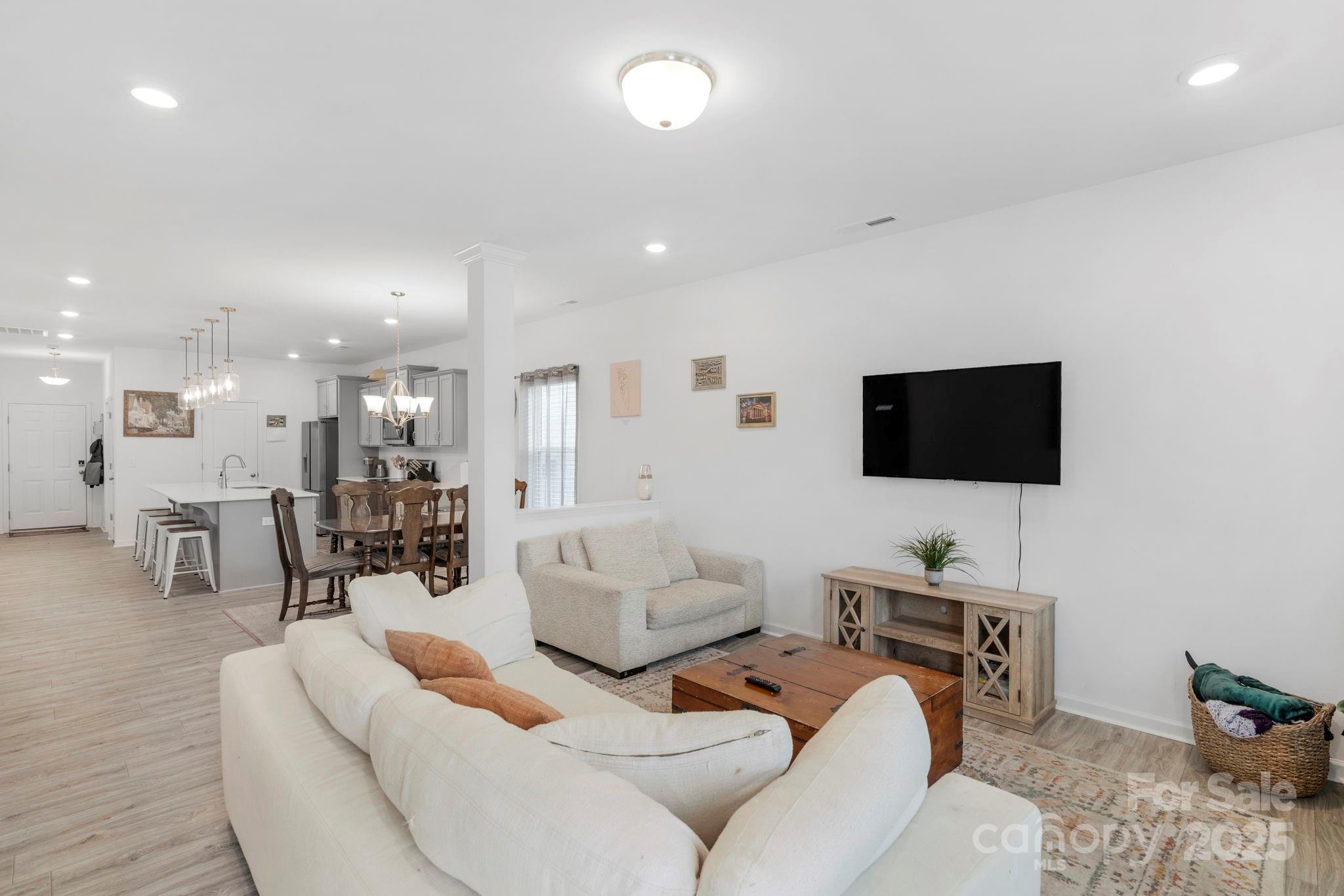 106 Aspire Circle Wingate, NC 28174 - Photo 35 of 39 a living room with furniture and a flat screen tv