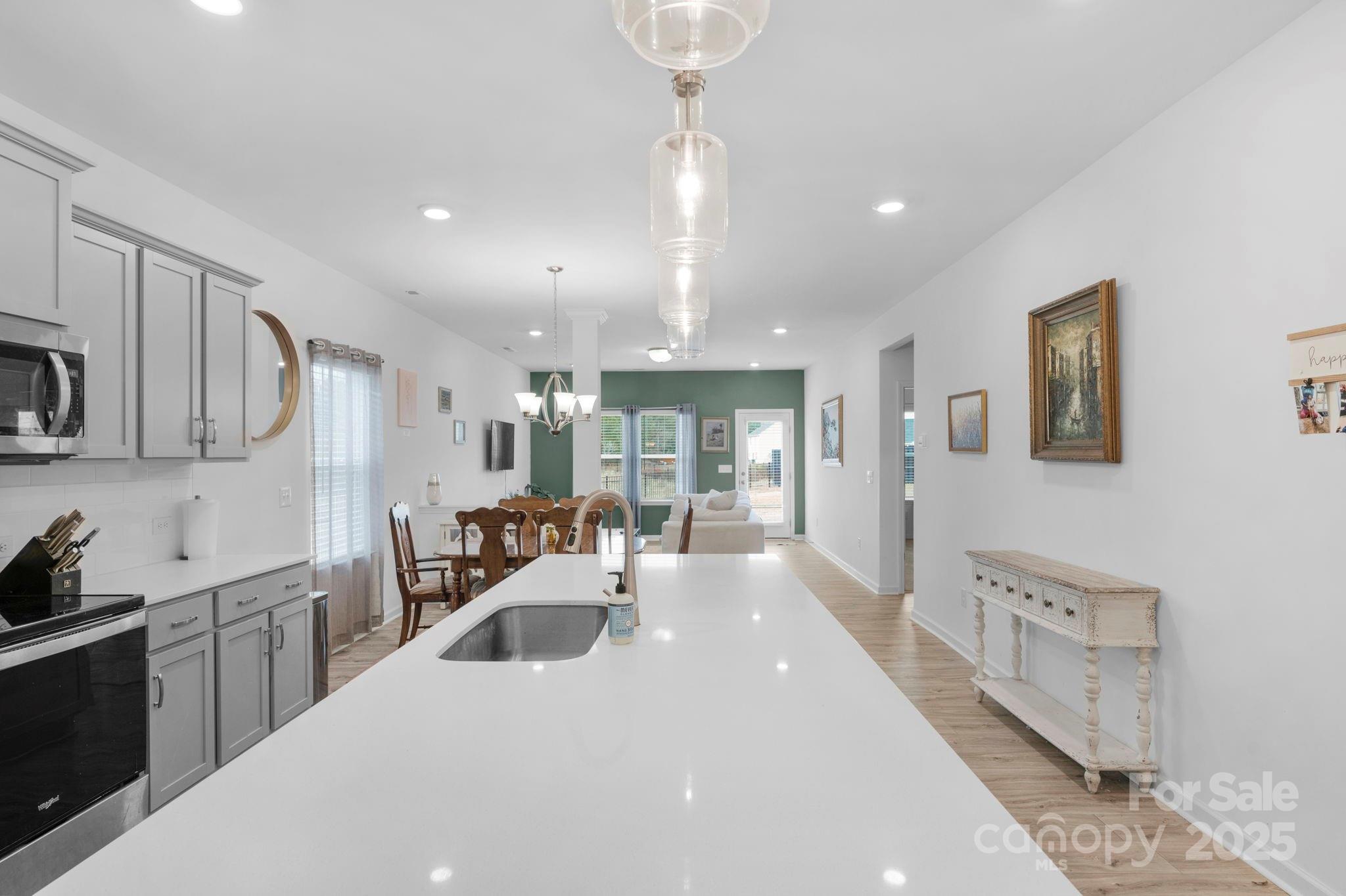 106 Aspire Circle Wingate, NC 28174 - Photo 8 of 39 a large white kitchen with a large window
