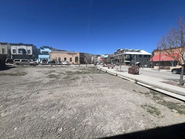 a view of a car park in front of the house