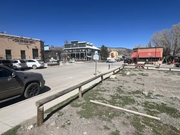 a view of a street with cars