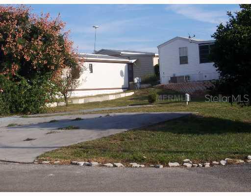 251 Patterson Road, Unit 1 Haines City, FL 33844 - Photo 1 of 1 a view of a house with a yard and a garage
