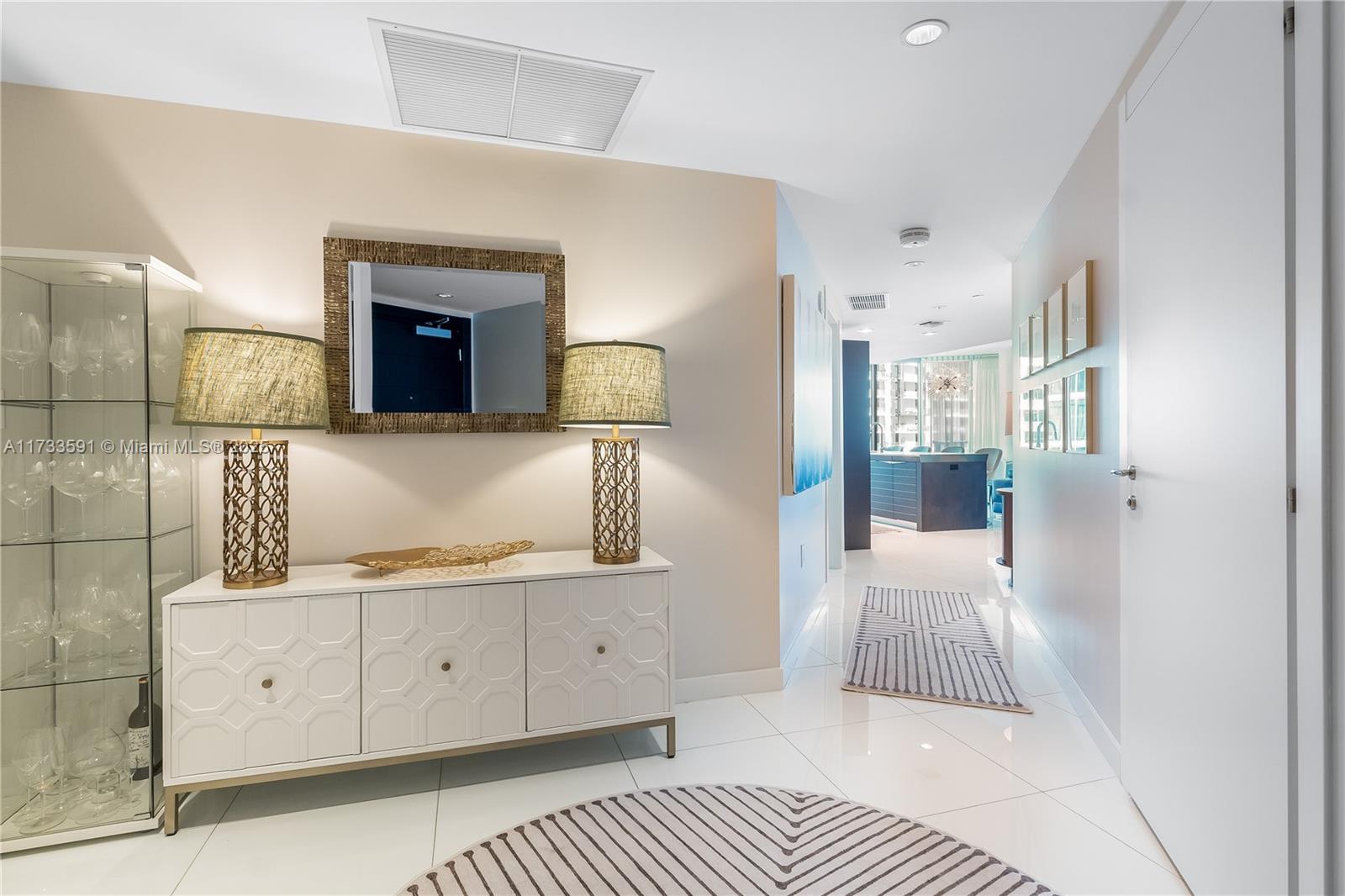 200 Biscayne Blvd Way, Unit 4101 Miami, FL 33131 - Photo 11 of 30 a bedroom with a bed and a couch