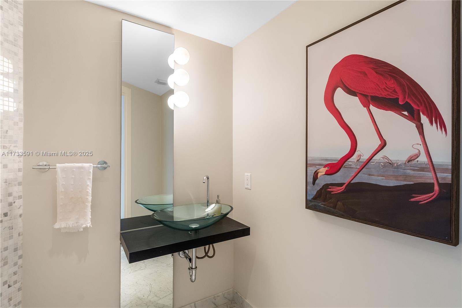 200 Biscayne Blvd Way, Unit 4101 Miami, FL 33131 - Photo 12 of 30 a room with a table and a potted plant