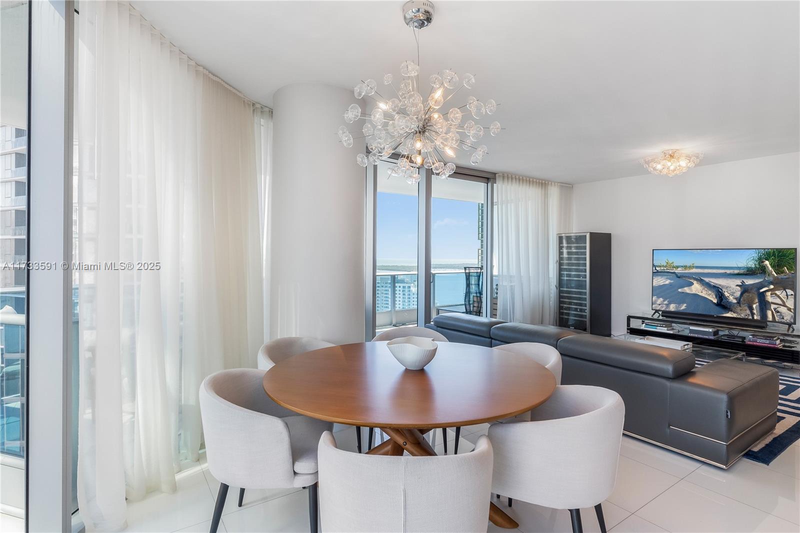 200 Biscayne Blvd Way, Unit 4101 Miami, FL 33131 - Photo 5 of 30 a view of a dining room with furniture and chandelier