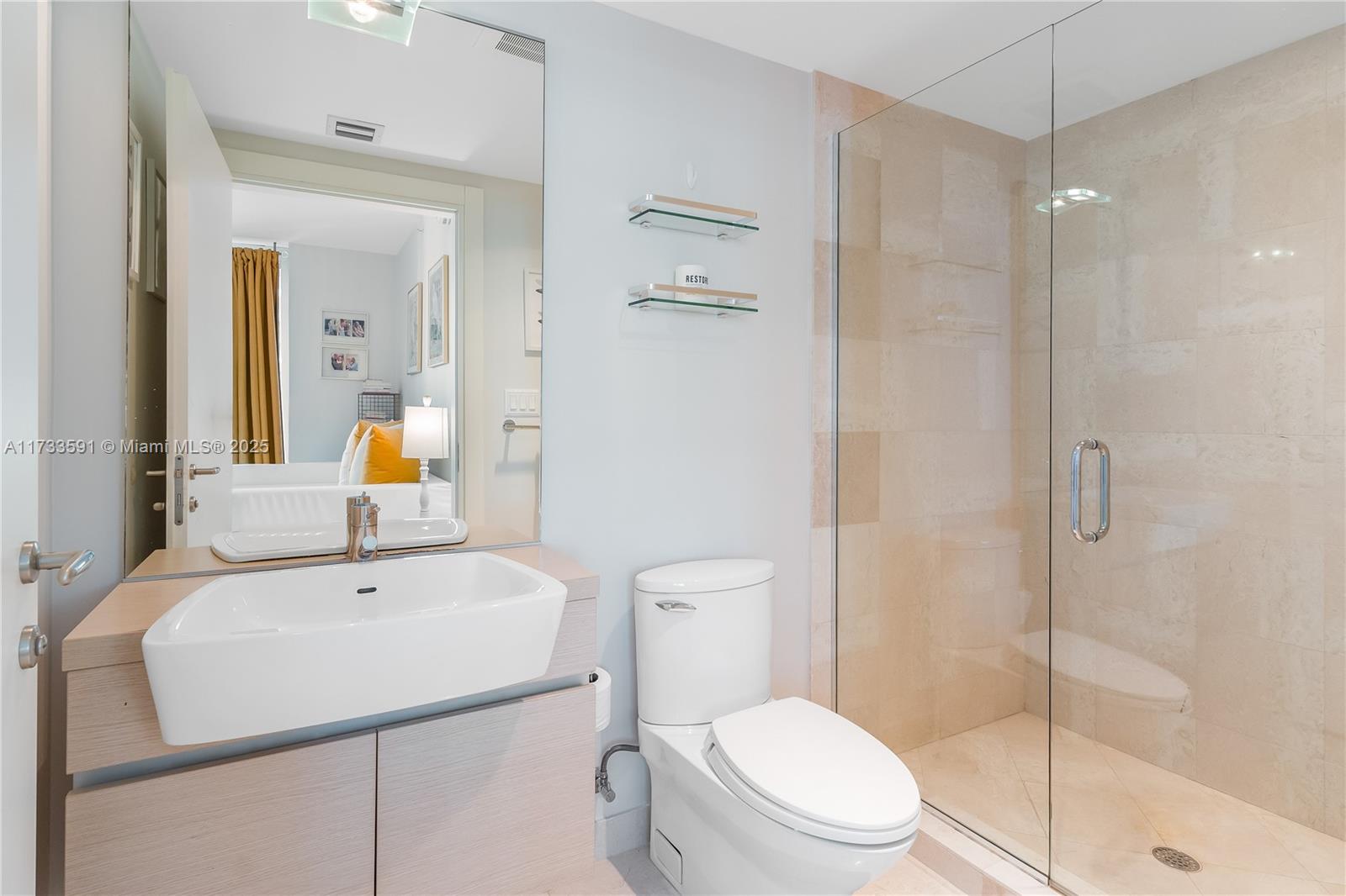 200 Biscayne Blvd Way, Unit 4101 Miami, FL 33131 - Photo 10 of 30 a bathroom with a sink a toilet and shower