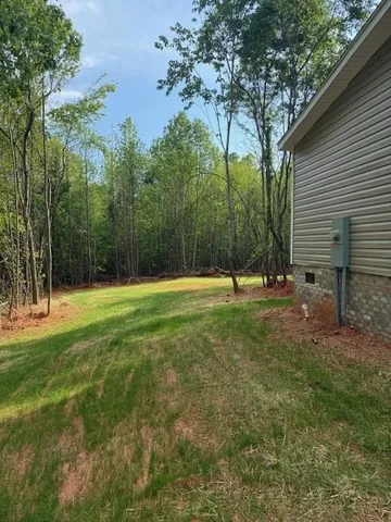 a view of a yard with a slide