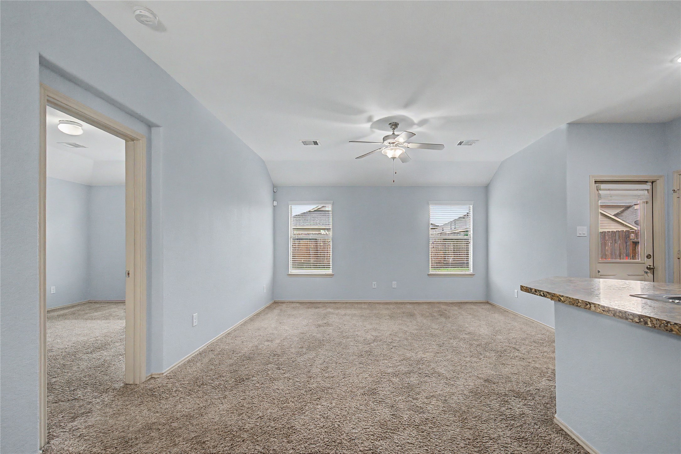 16430 Rodeo River Road Houston, TX 77049 - Photo 21 of 34 a view of a livingroom with a chandelier fan