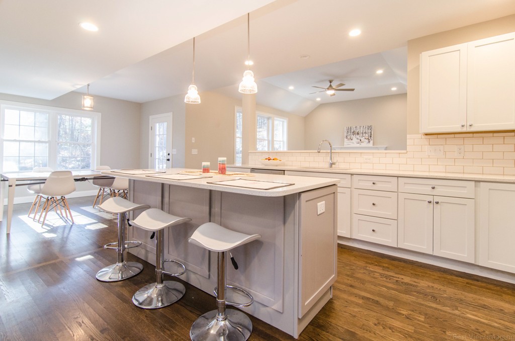 718 Main Street Acton, MA 01720 - Photo 11 of 28 a kitchen with counter space dining table and chairs