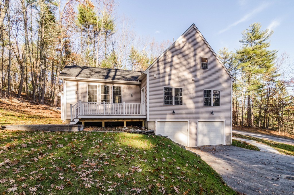 718 Main Street Acton, MA 01720 - Photo 28 of 28 a front view of a house with a yard