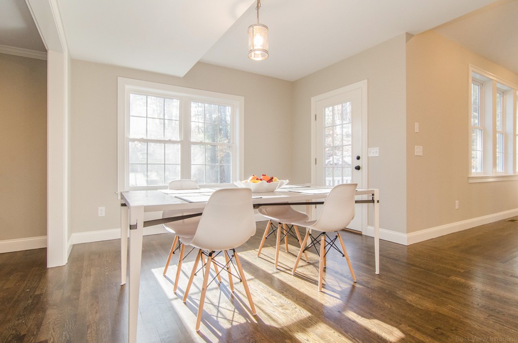 718 Main Street Acton, MA 01720 - Photo 6 of 28 a view of a dining room with furniture a chandelier and wooden floor
