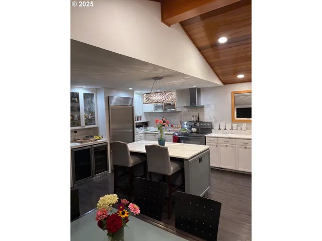 a view of a hallway of a house and chandelier