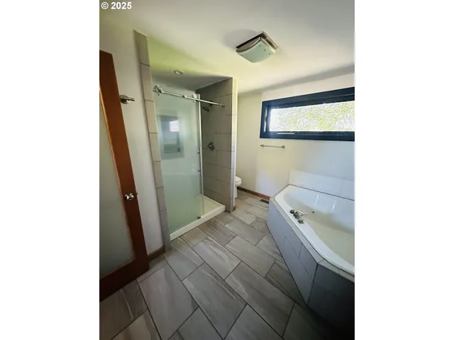 a en suite bathroom with a sink and a mirror