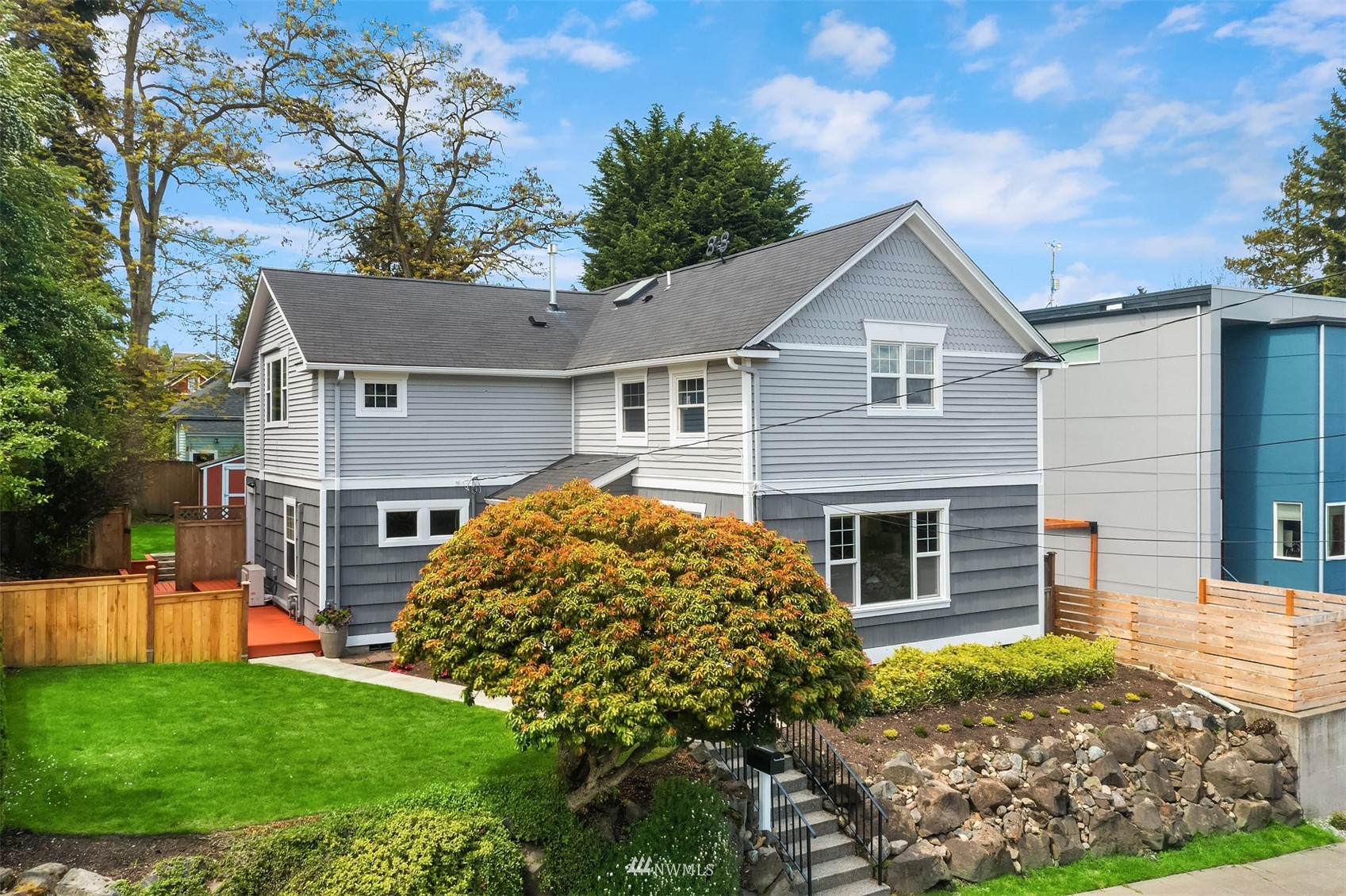 6065 5th Avenue Northeast Seattle, WA 98115 - Photo 1 of 40 a front view of a house with garden