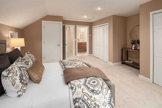 a bedroom with bed and a couch