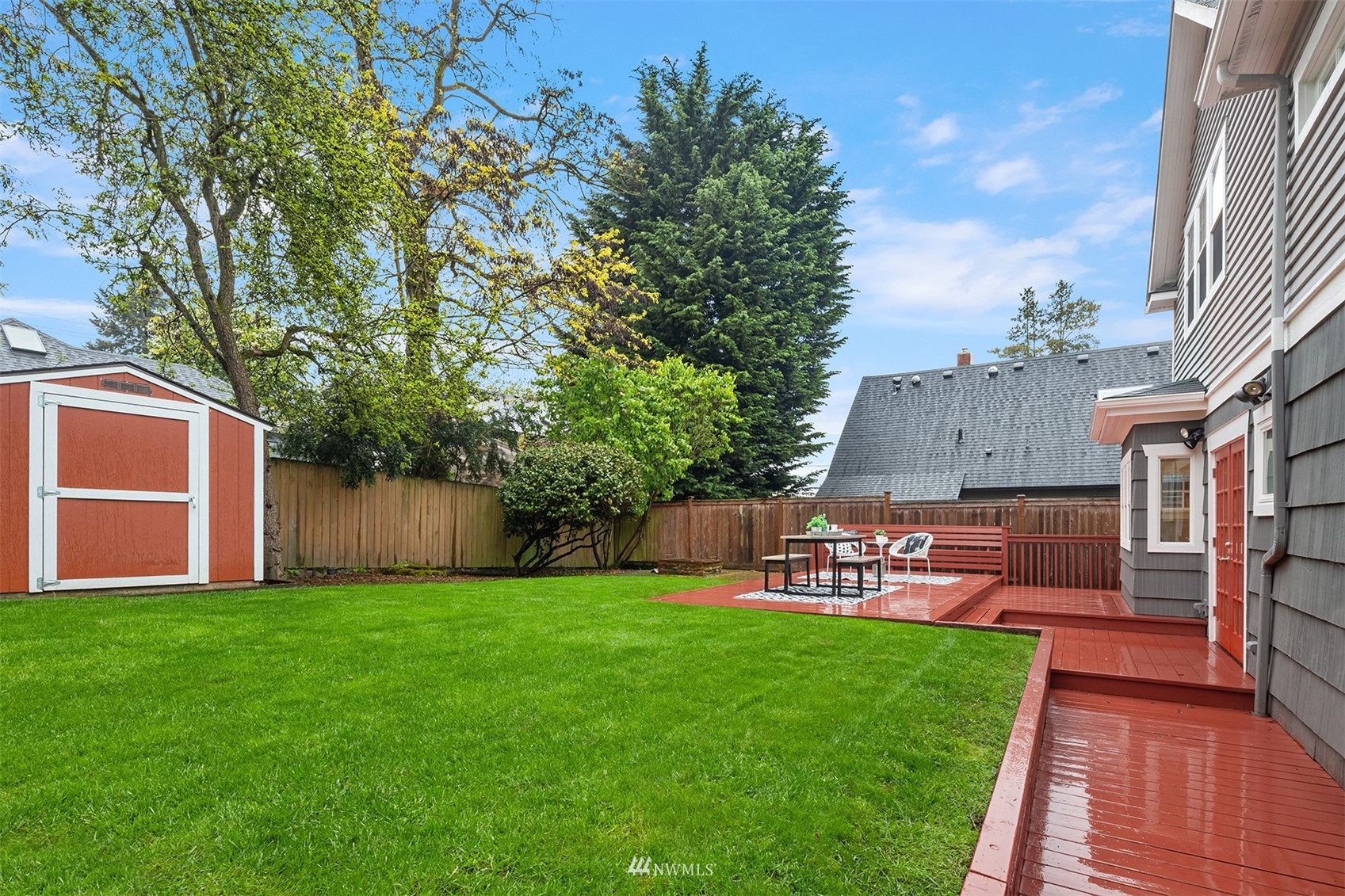 6065 5th Avenue Northeast Seattle, WA 98115 - Photo 34 of 40 a view of a yard with a table and chairs