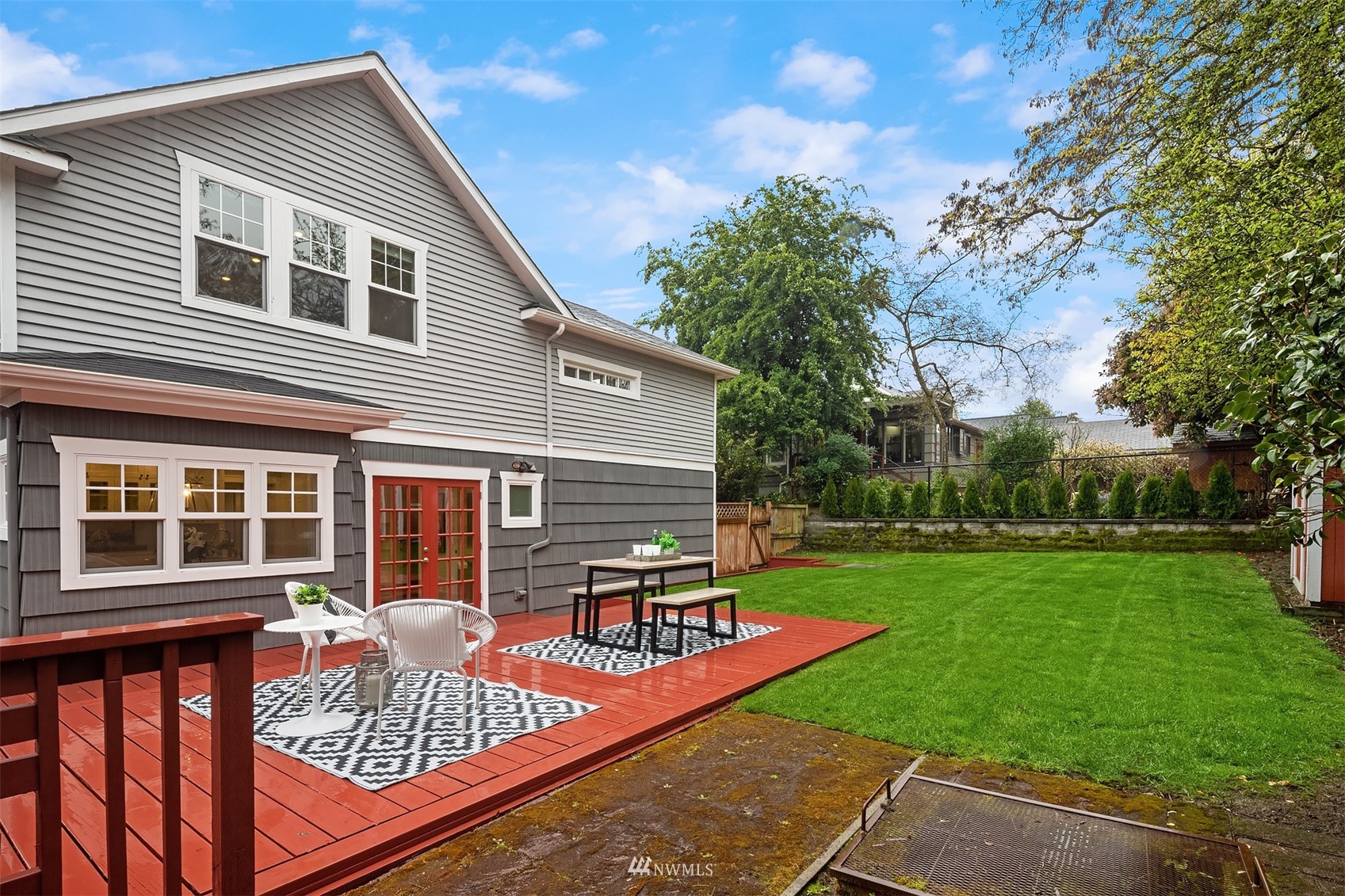 6065 5th Avenue Northeast Seattle, WA 98115 - Photo 36 of 40 a view of a house with backyard and sitting area