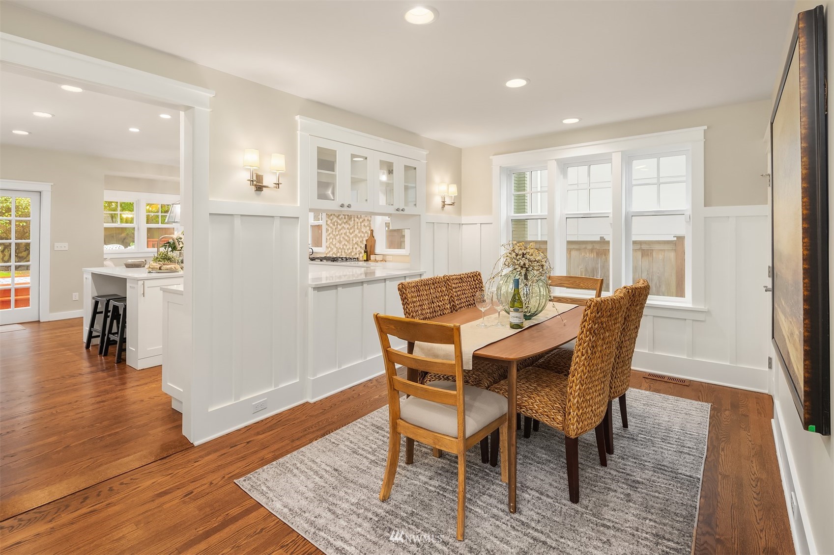6065 5th Avenue Northeast Seattle, WA 98115 - Photo 6 of 40 a view of a dining room with furniture and wooden floor
