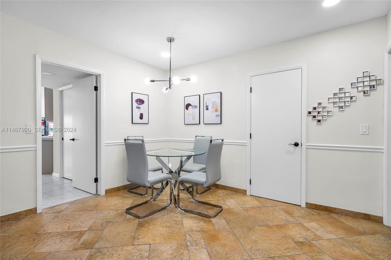 2500 Northeast 199th Street Miami, FL 33180 - Photo 18 of 72 a view of a room with table and chairs