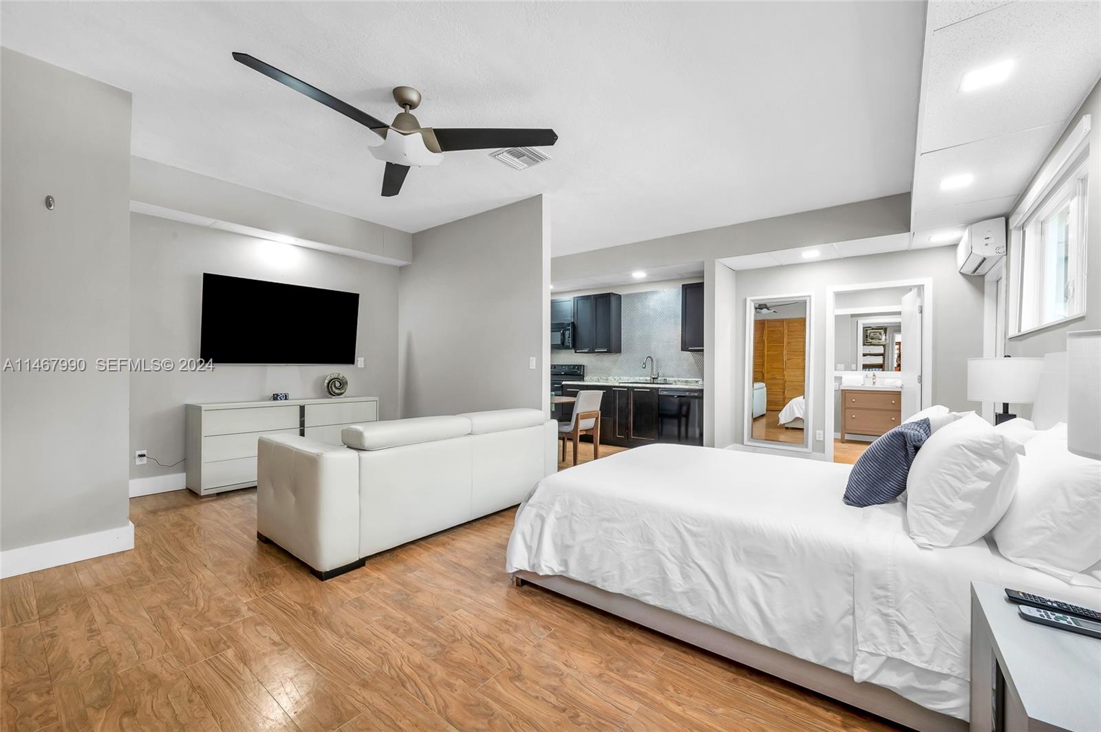 2500 Northeast 199th Street Miami, FL 33180 - Photo 31 of 72 a bedroom with a bed and a flat screen tv