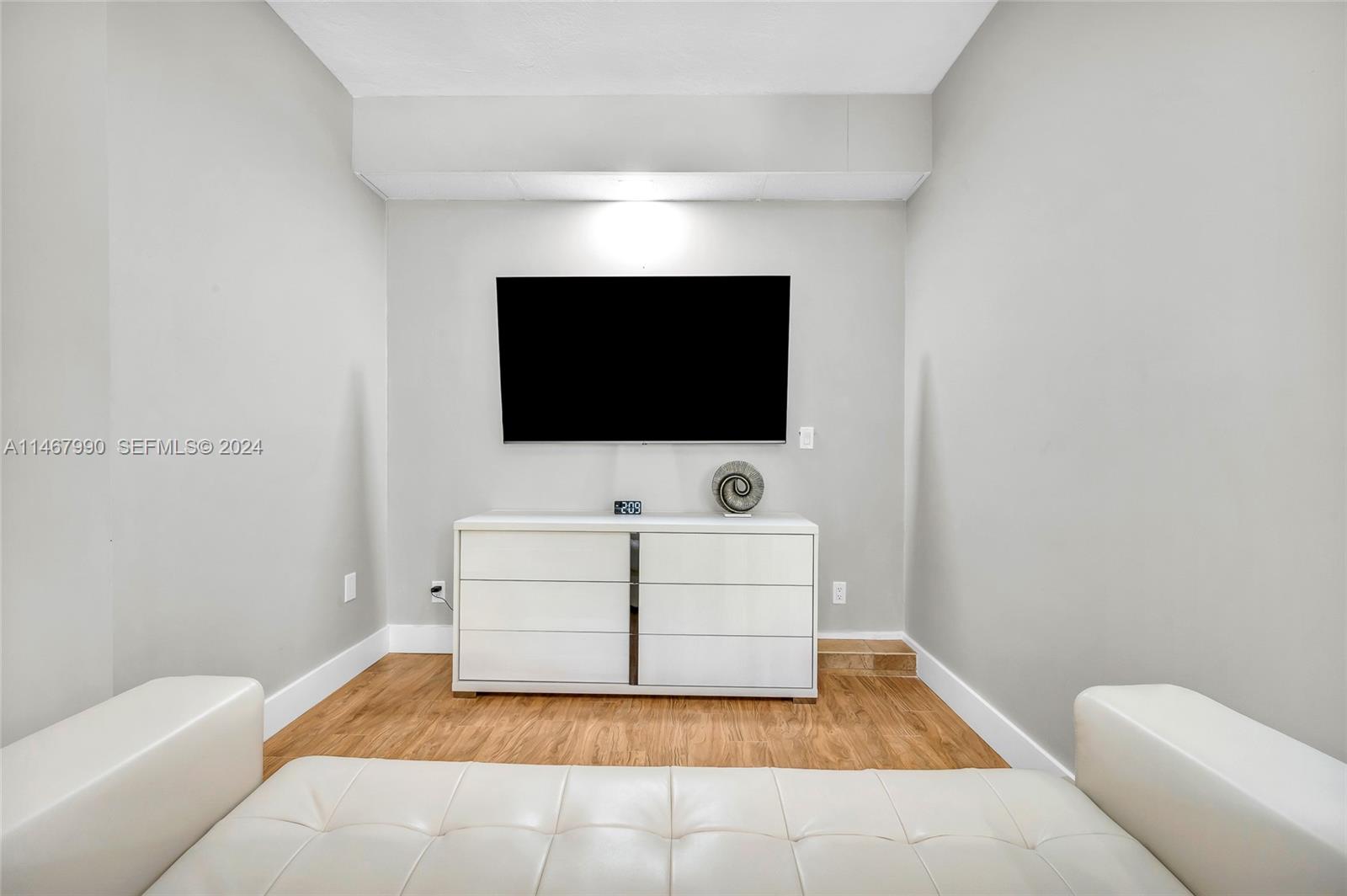 2500 Northeast 199th Street Miami, FL 33180 - Photo 34 of 72 a living room with furniture and a flat screen tv