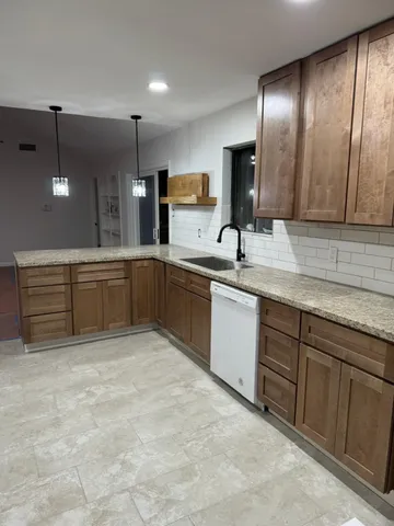 a kitchen with a sink and cabinets