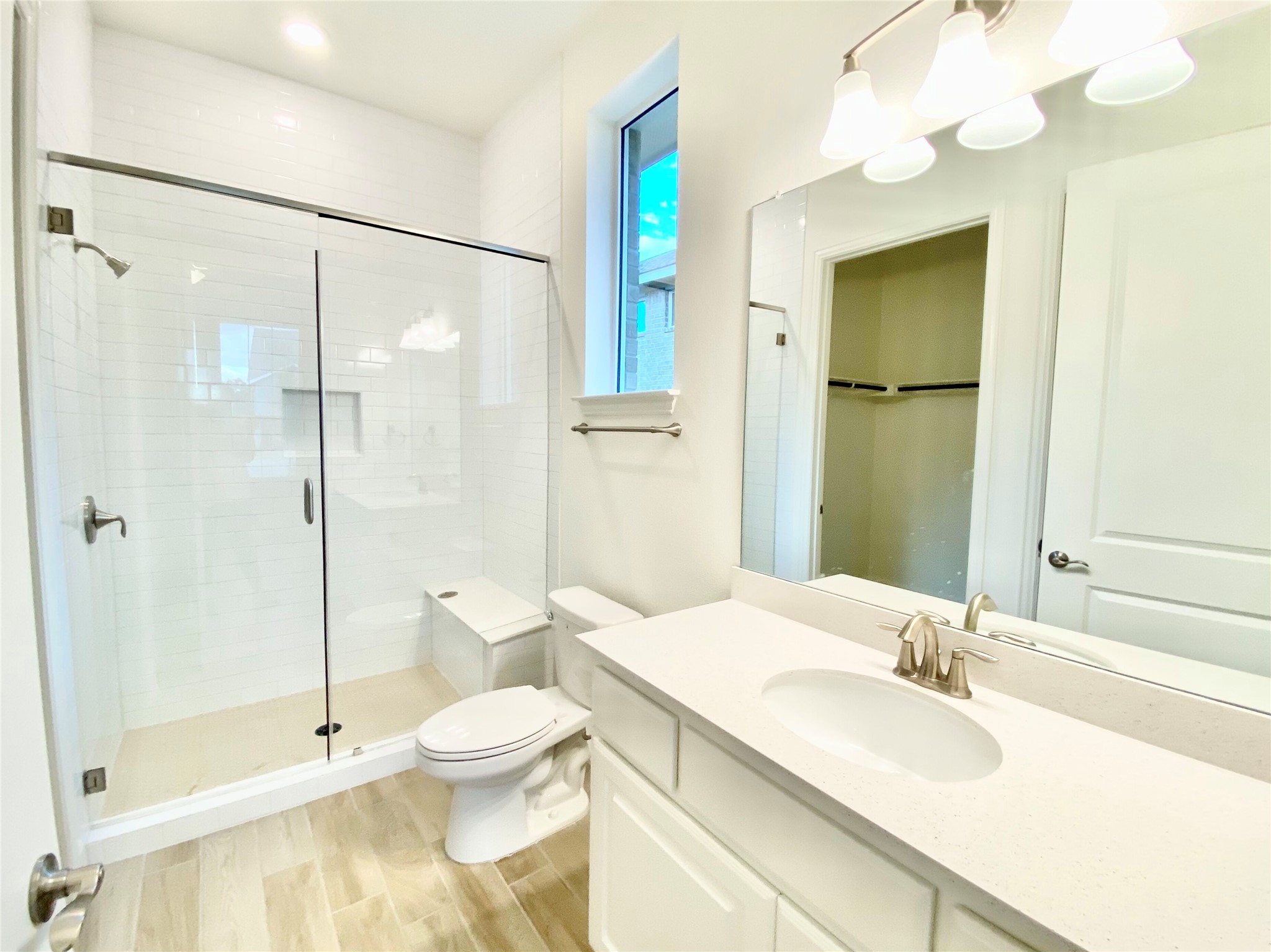 6009 Cimarron Ridge Lane Austin, TX 78738 - Photo 13 of 21 a bathroom with a sink toilet and shower