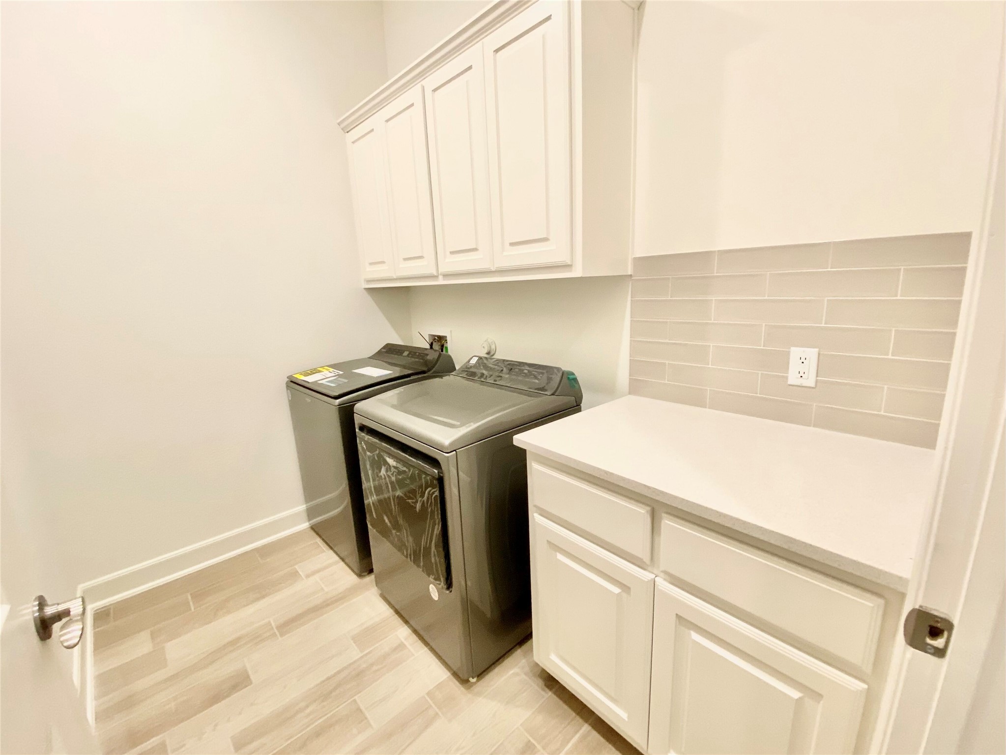 6009 Cimarron Ridge Lane Austin, TX 78738 - Photo 16 of 21 a utility room with dryer and washer