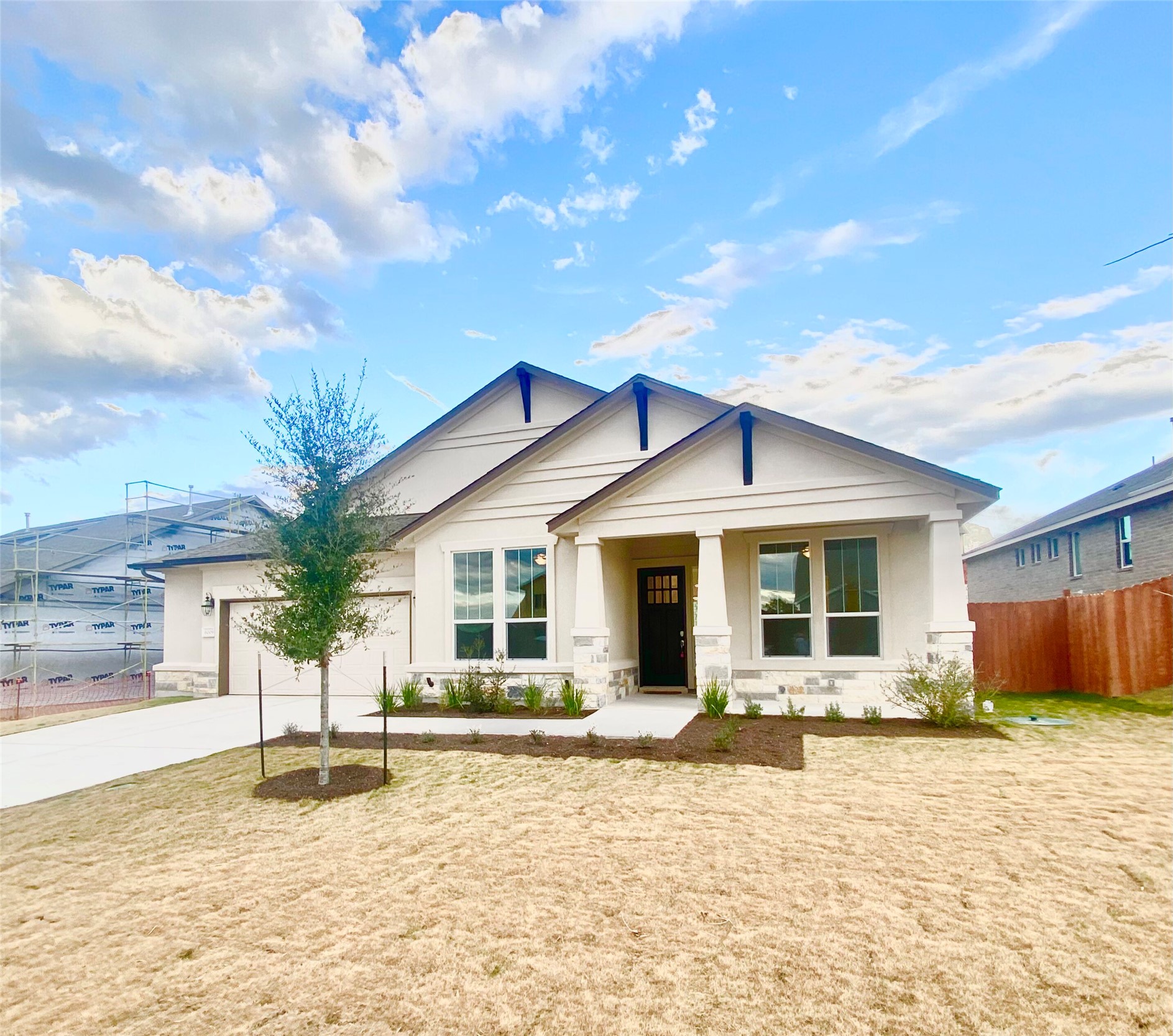6009 Cimarron Ridge Lane Austin, TX 78738 - Photo 2 of 21 a house with palm tree in front of it