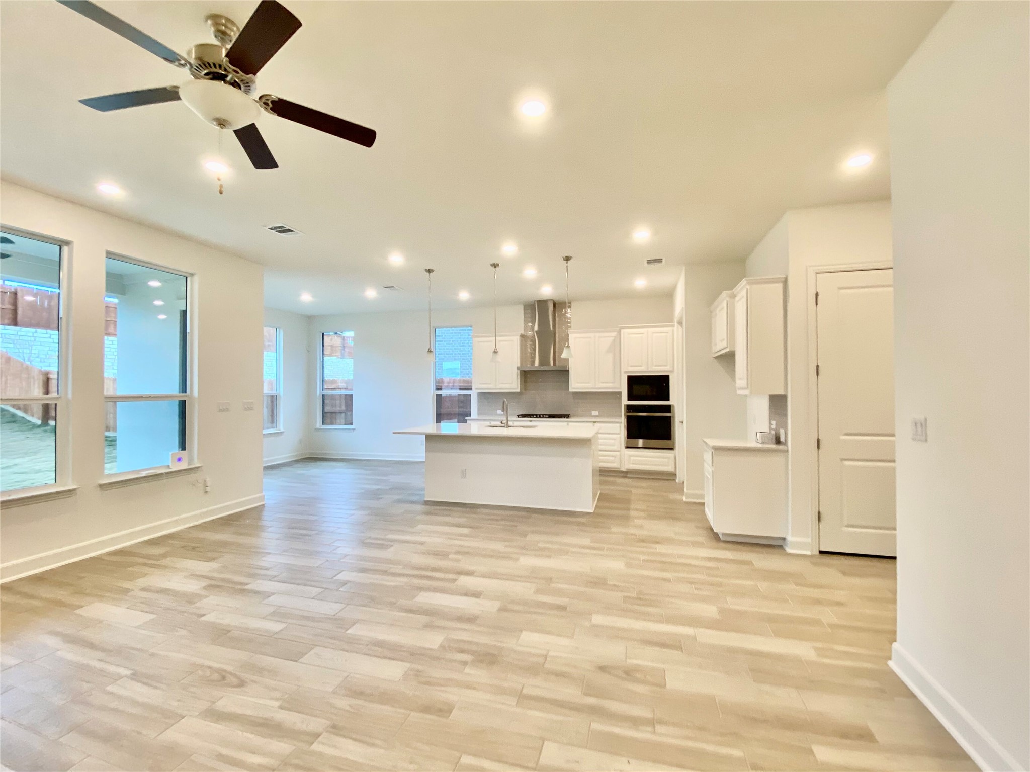 6009 Cimarron Ridge Lane Austin, TX 78738 - Photo 21 of 21 a view of kitchen with kitchen island stainless steel appliances cabinets stove and a window