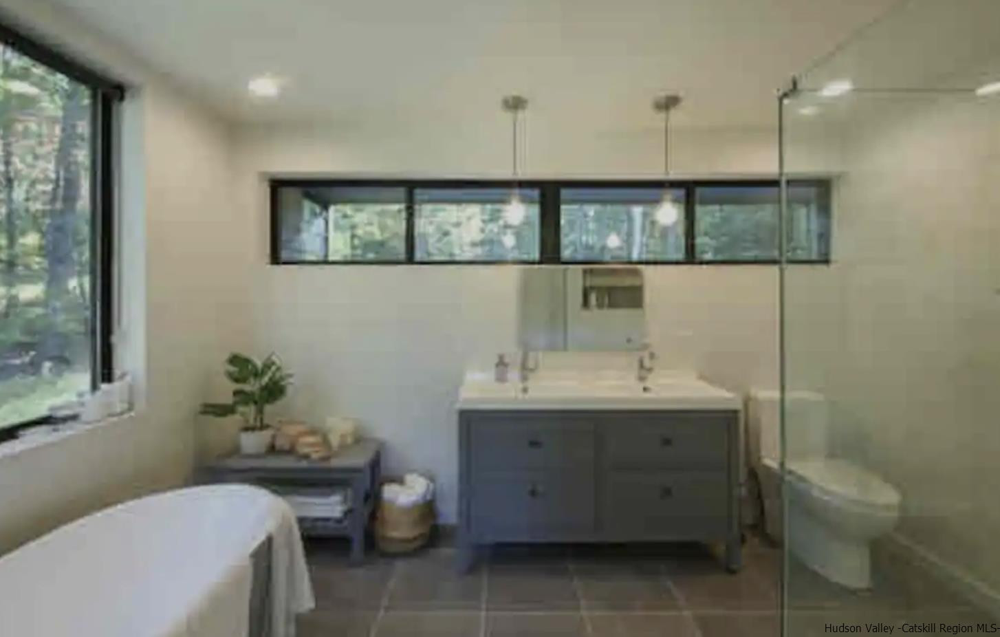 49 Aster Road Kerhonkson, NY 12446 - Photo 15 of 34 a bathroom with a toilet a sink and mirror