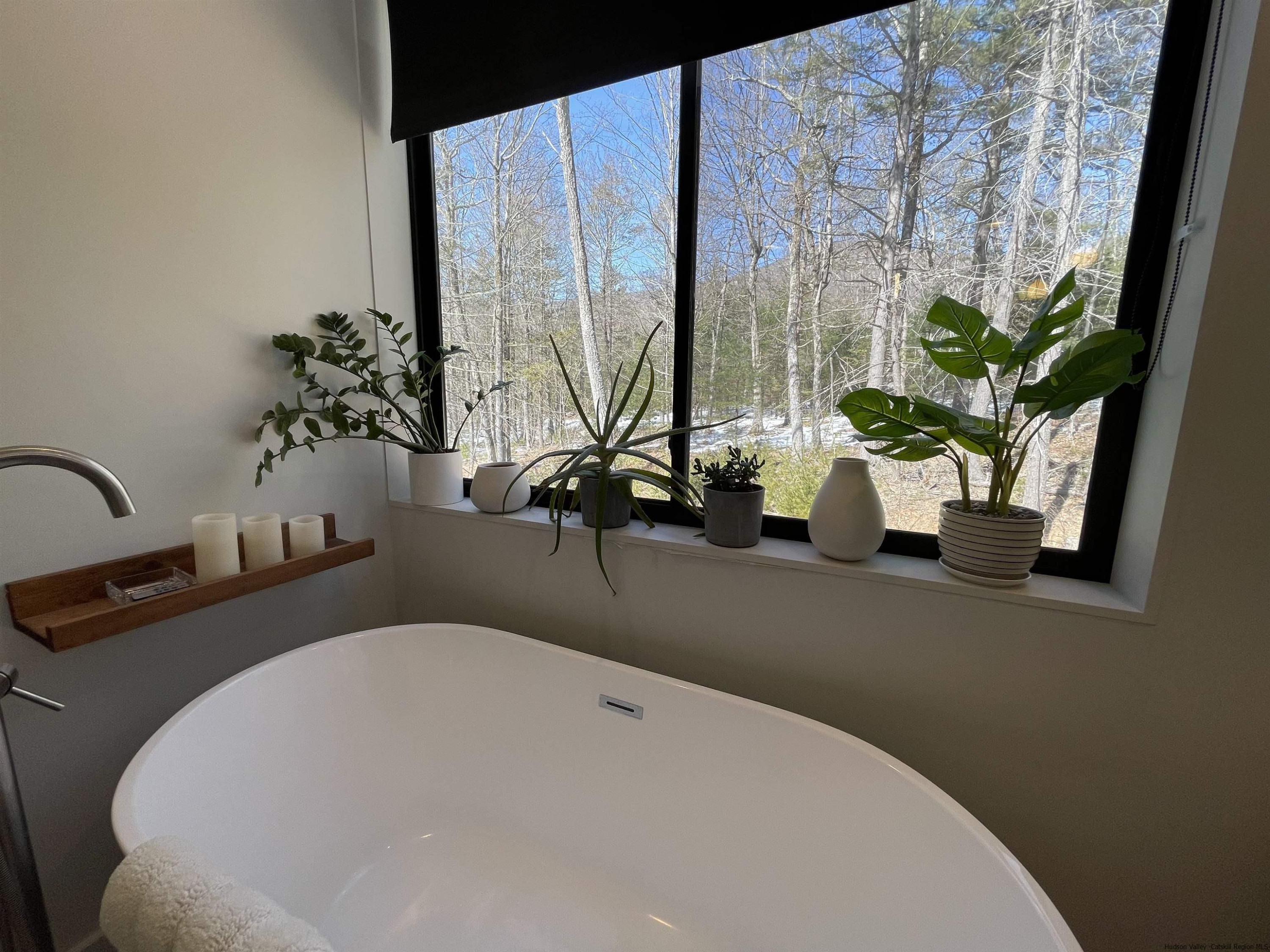 49 Aster Road Kerhonkson, NY 12446 - Photo 16 of 34 a bathroom with a double vanity sink and a mirror