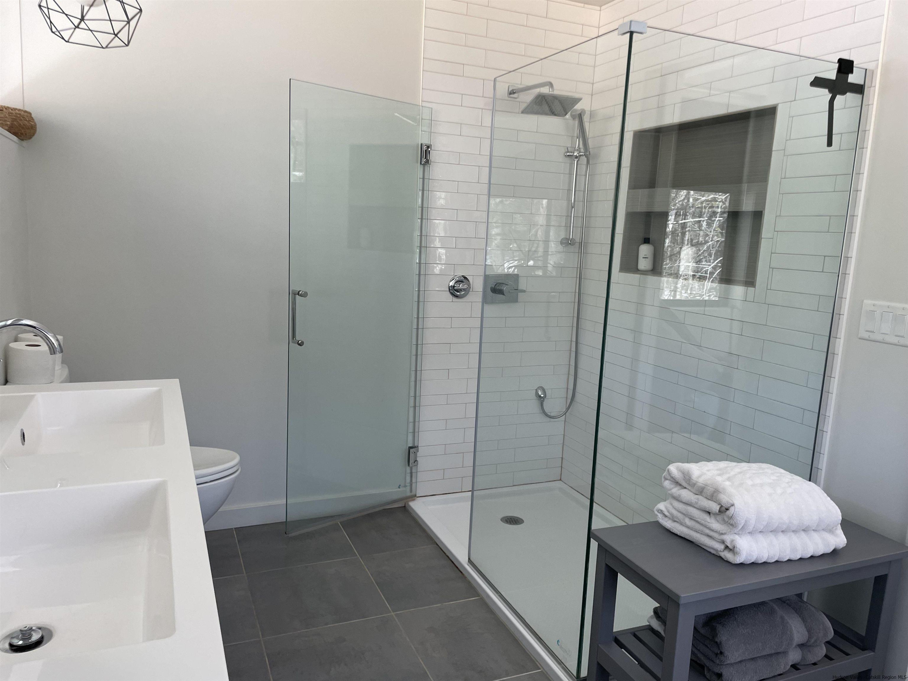 49 Aster Road Kerhonkson, NY 12446 - Photo 17 of 34 a bathroom with a shower toilet and sink