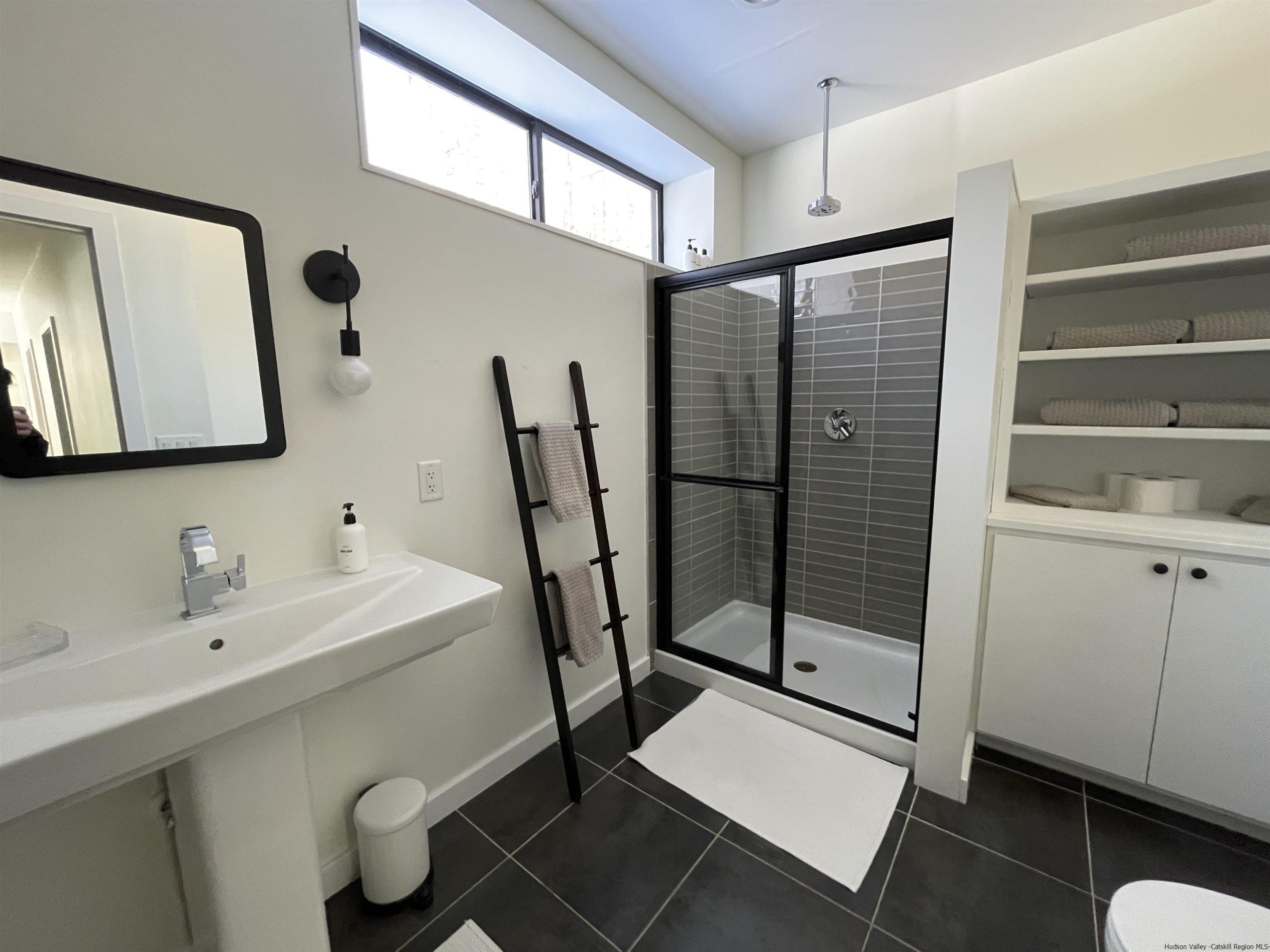 49 Aster Road Kerhonkson, NY 12446 - Photo 18 of 34 a bathroom with a sink mirror and toilet