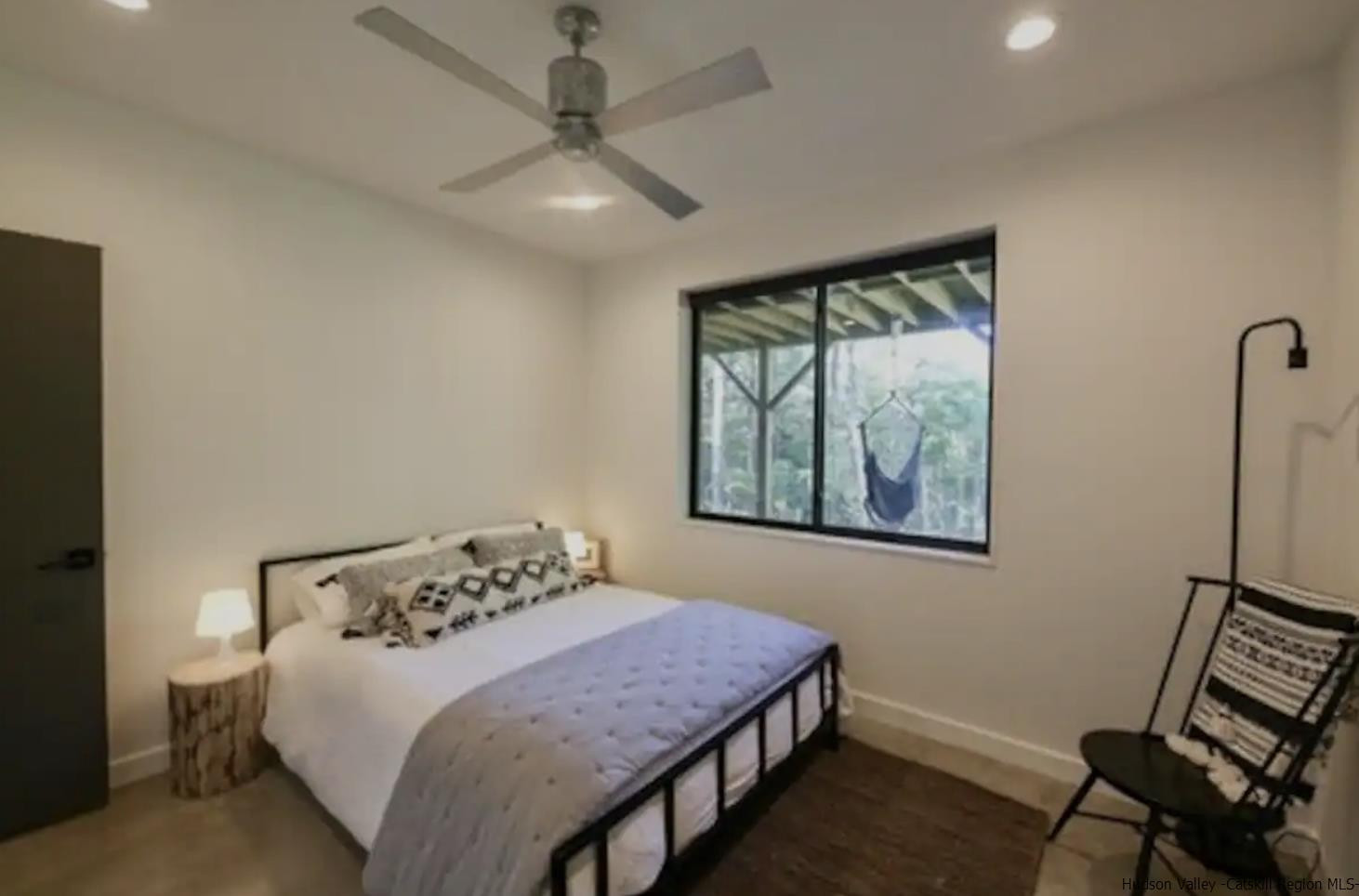 49 Aster Road Kerhonkson, NY 12446 - Photo 23 of 34 a bedroom with a bed and a window