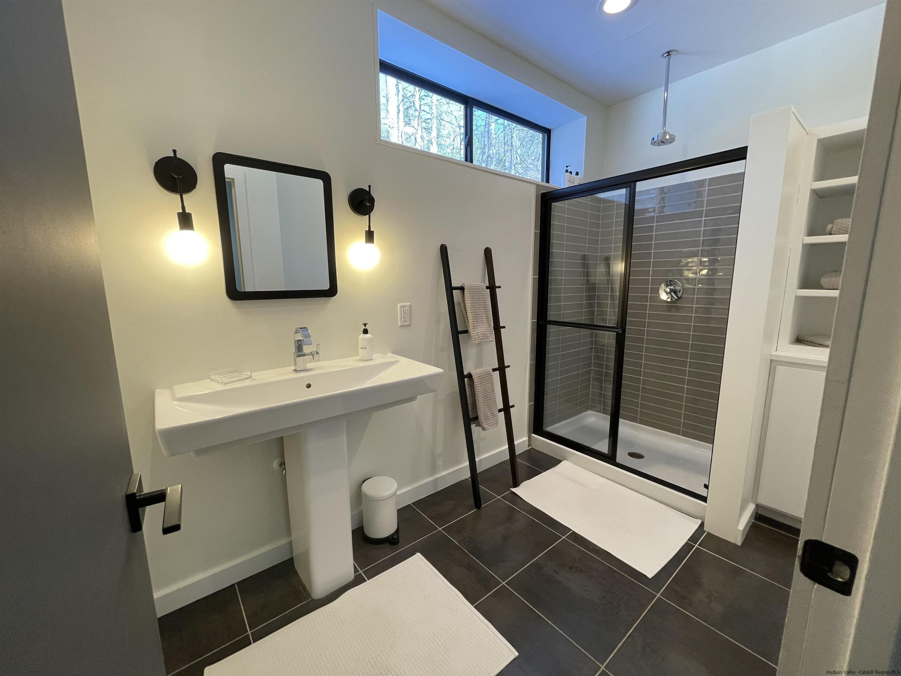 49 Aster Road Kerhonkson, NY 12446 - Photo 25 of 34 a bathroom with a sink toilet and shower
