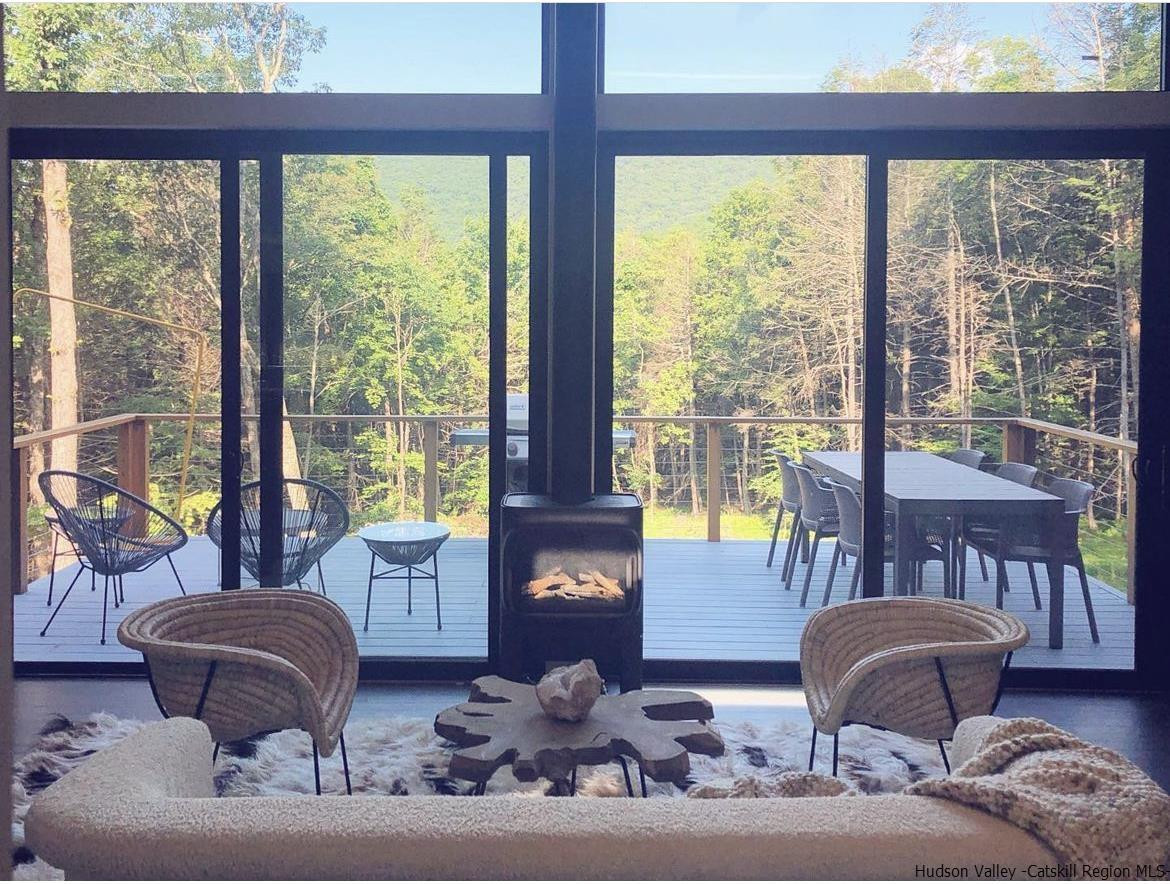 49 Aster Road Kerhonkson, NY 12446 - Photo 3 of 34 a living room with furniture and two large windows