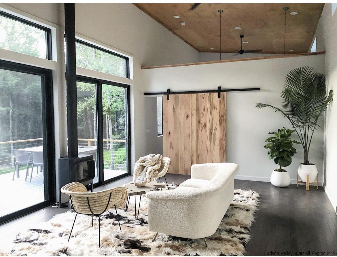 49 Aster Road Kerhonkson, NY 12446 - Photo 4 of 34 a living room with furniture and a large window