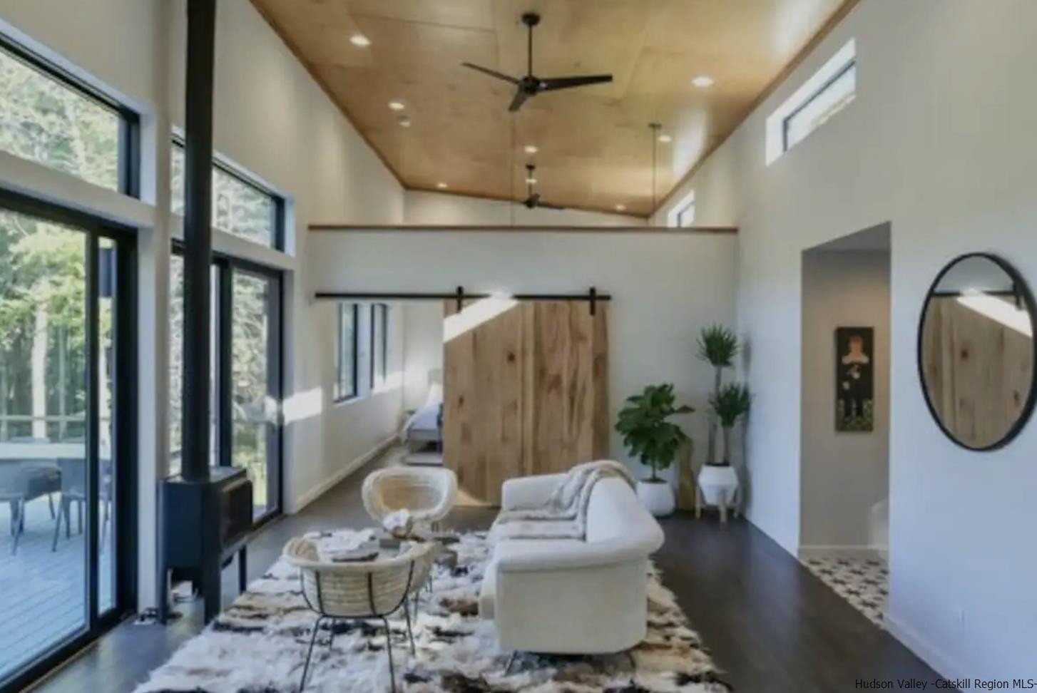 49 Aster Road Kerhonkson, NY 12446 - Photo 6 of 34 a living room with furniture a window and a chandelier