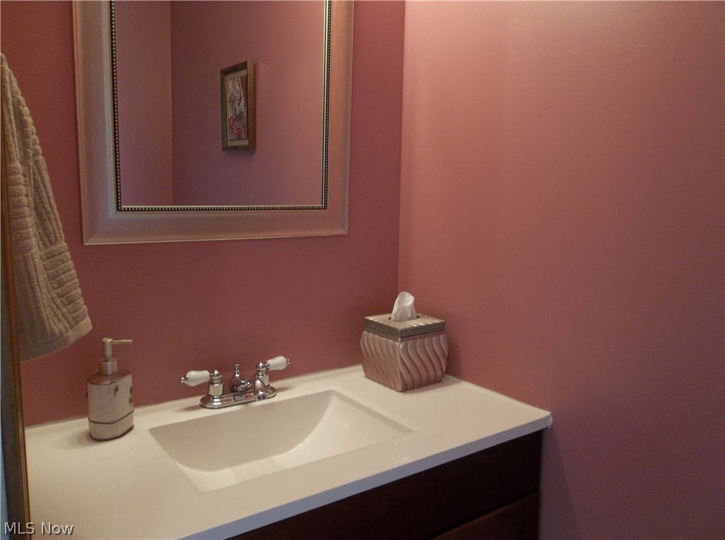 70 Boulder Ridge Place Painesville, OH 44077 - Photo 10 of 26 This is the the completely updated half bathroom on the first floor. It has a new vanity, mirror, faucet, toilet & towel bars.