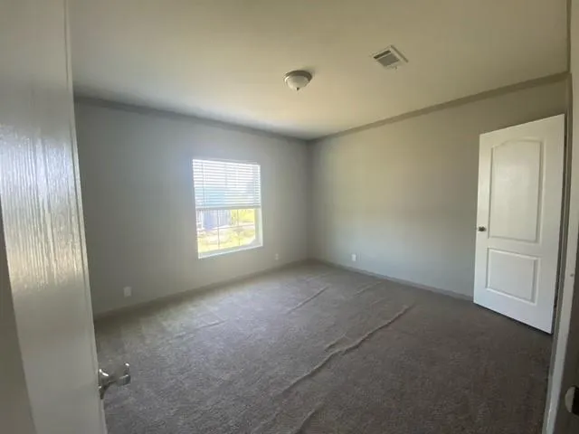 a view of empty room with windows