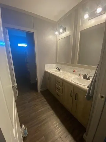 a bathroom with a sink and mirror